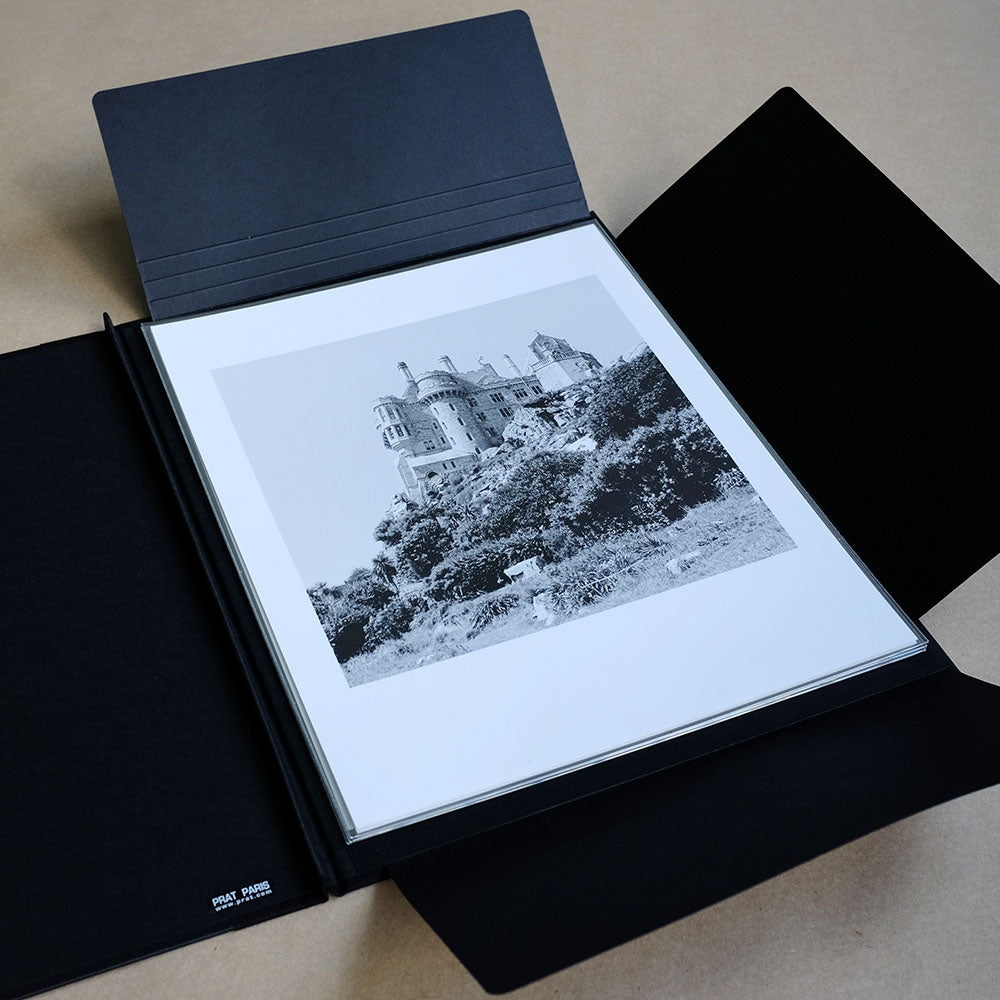 Well styled version of the classic art portfolio, inexpensive and an ideal way of storing and transporting prints, as well as supplying them to clients. They feature tough black texture finish board, with fabric reinforced corners. The portfolios are closed and fastened with strings on each open side.