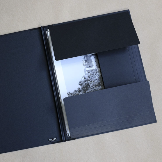 Well styled version of the classic art portfolio, inexpensive and an ideal way of storing and transporting prints, as well as supplying them to clients. They feature tough black texture finish board, with fabric reinforced corners. The portfolios are closed and fastened with strings on each open side.